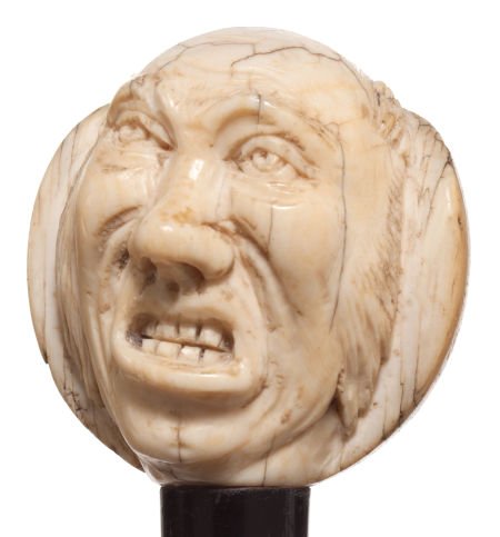 A CARVED IVORY AND WOOD FIGURAL CANE Circa 1900: A CARVED IVORY AND WOOD FIGURAL CANE Circa 1900 36-1/2 inches length overall (92.