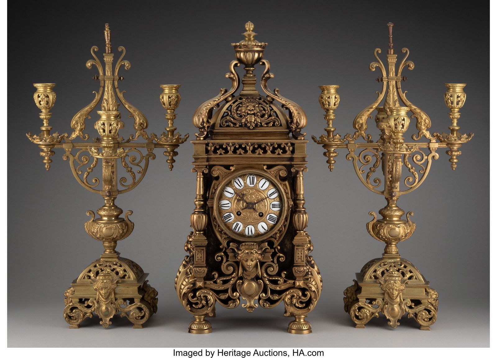 A Three-Piece Tiffany & Co. Gilt Bronze Clock Ga: A Three-Piece Tiffany & Co. Gilt Bronze Clock Garniture Set Marks: TIFFANY & CO. Marks to movement: P.S., 16409, 52 21-1/2 x 11-1/4