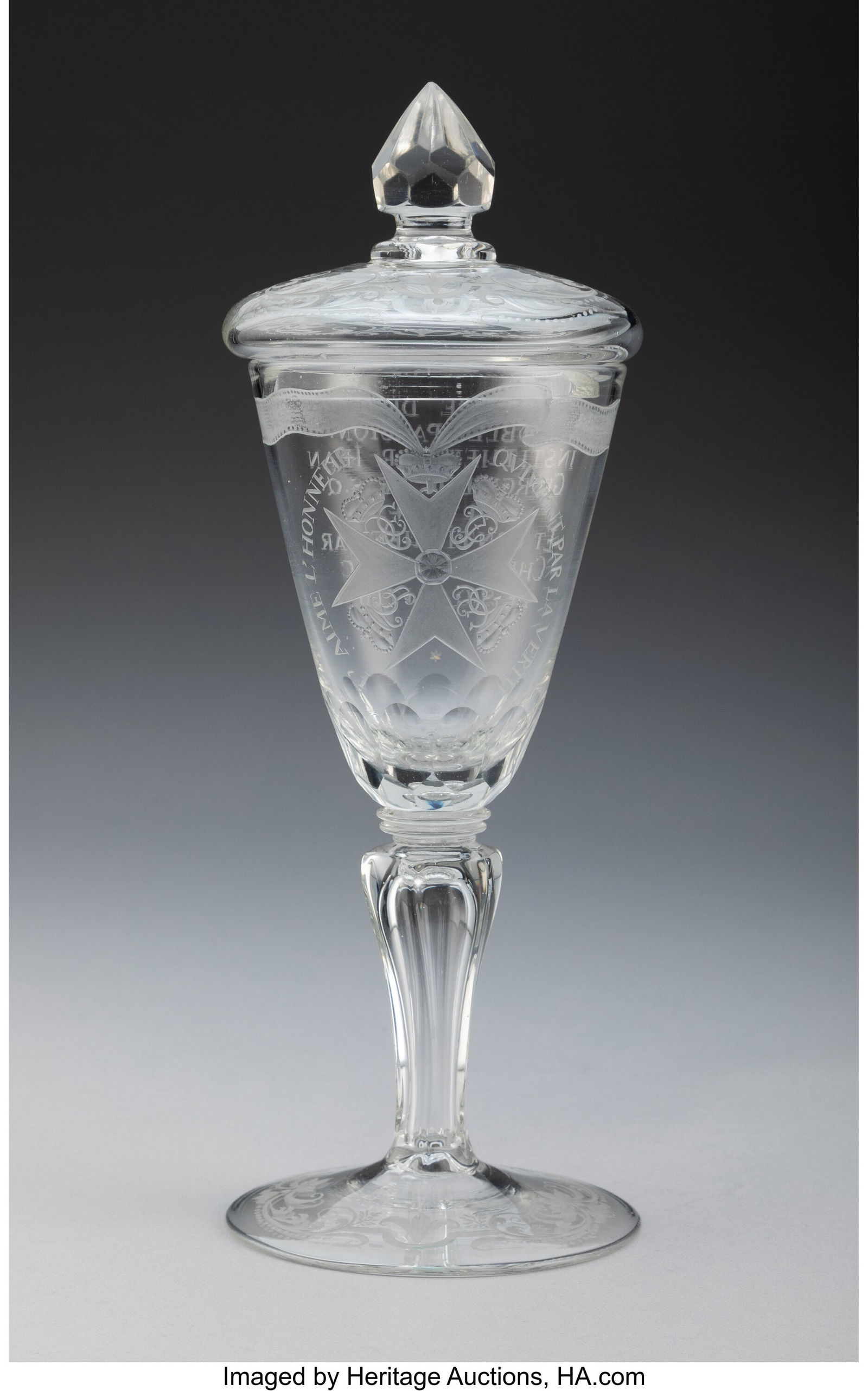 A German Engraved Glass Covered Goblet, circa 17: A German Engraved Glass Covered Goblet, circa 1716 12-1/4 x 4-1/2 inches (31.1 x 11.4 cm) (diam.) Inscription: I' AIME L'HONNEUR QVIVIENT P