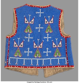 70204: A Sioux Beaded Hide Vest c. 1900 hide, metal