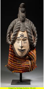 70339&colon; An Igbo Maiden Spirit Helmet Mask&comma; ogbogho mmuo : An Igbo Maiden Spirit Helmet Mask&comma; ogbogho mmuo Nigeria&comma; early 20th century Igbo art historian Herbert M&period; Cole identified this mask as coming from the Nsukka area of Nigeria&period;