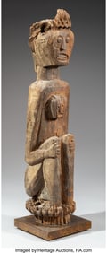 70368: A Dayak Seated Figure Borneo, 19th century or e