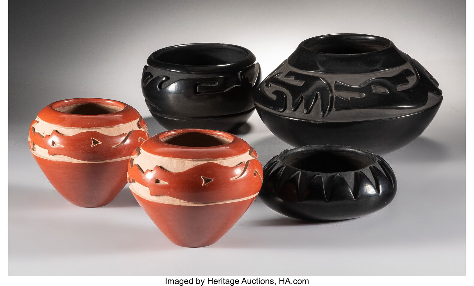 Five Santa Clara Carved Red/Blackware Jars in: Five Santa Clara Carved Red/Blackware Jars including two redware examples, each signed on the base Mida Tafoya; and three blackware examples, two signed Mida Tafoya, Santa C
