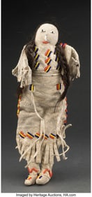 70471: A Sioux Beaded Hide Female Doll Height: 12 inc