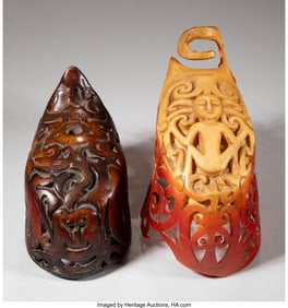 70522: Two Dayak Hornbill Ear Ornaments Lengths: 3 ¼;