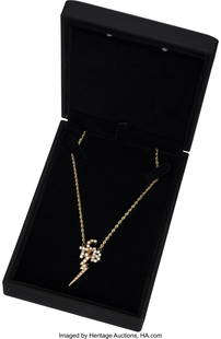 Elvis Presley 14K Gold and Diamond "TCB" Necklac: Elvis Presley 14K Gold and Diamond "TCB" Necklace From Original Mold in Presentation Case&period; Vintage original pendant of the famous "TCB" logo&comma; accented with diamonds and set in 14k yellow
