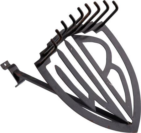 A Warner Bros. Tie Rack, Circa 1940s.: A Warner Bros. Tie Rack, Circa 1940s. Painted black, featuring the famous 'WB' shield log