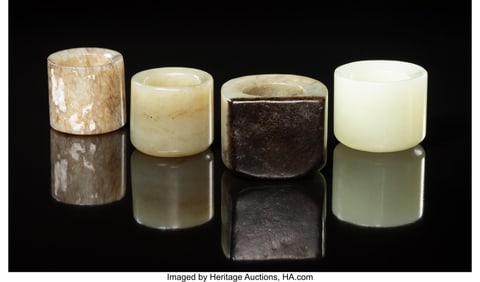 27059: A Group of Four Chinese Jade Archer's Rings 1-1/