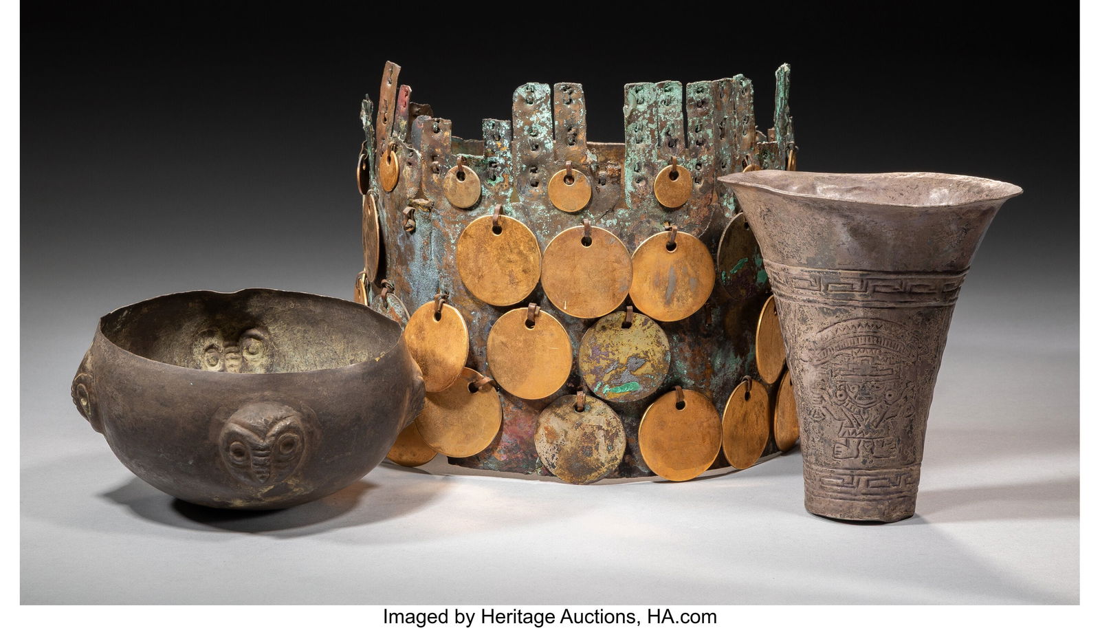 Three Peruvian Metal Items Peru, 1000-1400 AD: Three Peruvian Metal Items Peru, 1000-1400 AD Including a Moche or Chimu copper alloy bowl with four repousse owl or condor heads, a Sican/Lambayeque silver alloy drinking vessel with