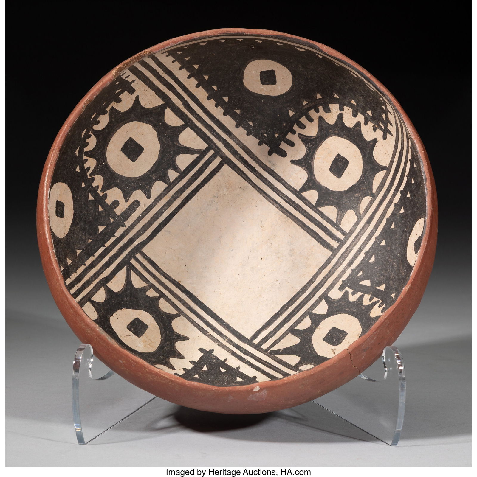 A Tonto / Gila Polychrome Bowl c. 1300 - 1450: A Tonto / Gila Polychrome Bowl c. 1300 - 1450 AD Painted on the interior in black and white, the design with four panels each enclosing serrated circular elements. Diameter&col
