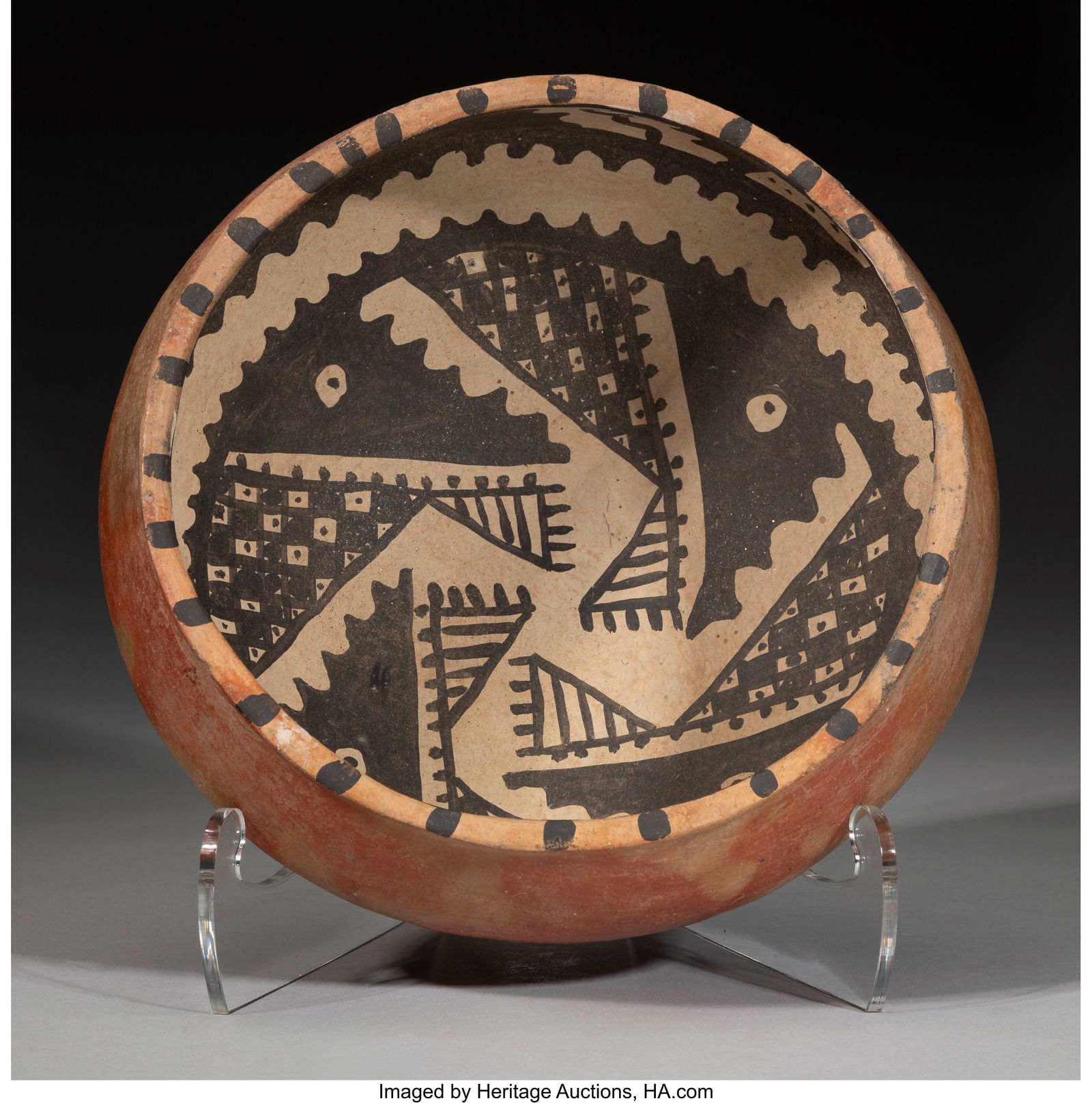 A Tonto / Gila Polychrome Bowl c. 1300 - 1450: A Tonto / Gila Polychrome Bowl c. 1300 - 1450 AD Intact bowl, painted in black and white, with serrated and checkered patterns in the basin, a series of trapezoids,