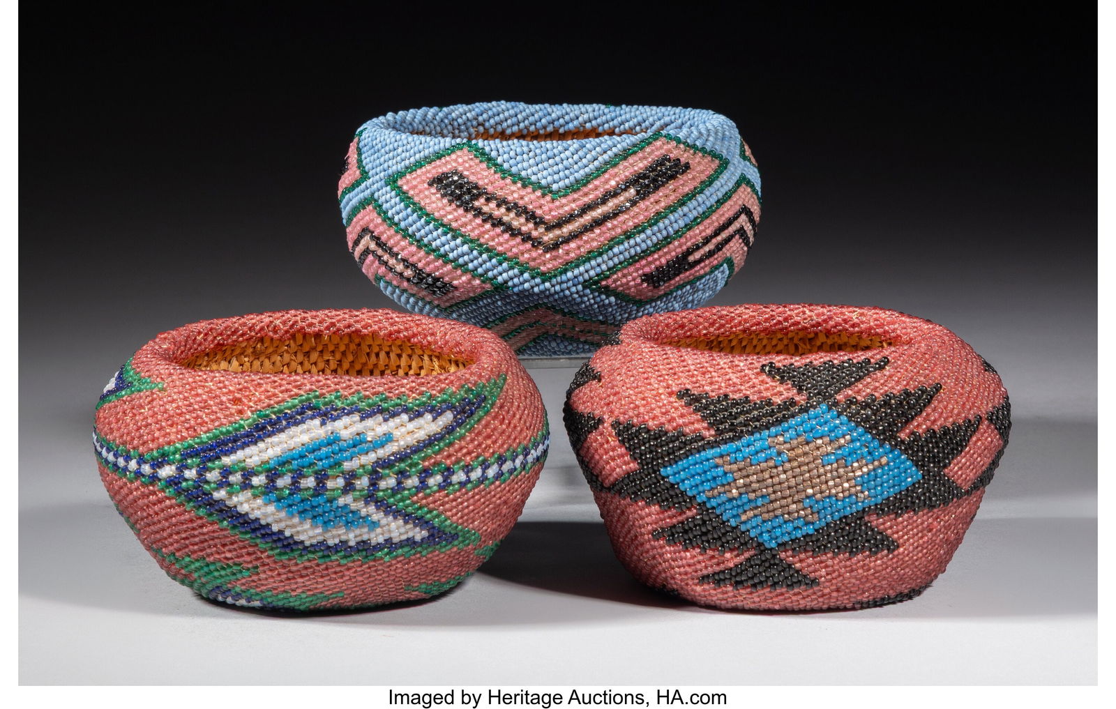 Three Paiute Beaded Baskets c. 1940 Each cons: Three Paiute Beaded Baskets c. 1940 Each consisting of willow and glass seed beads, with classic geometric devices covering the body. Diameters: 4 &frac14; inches ea