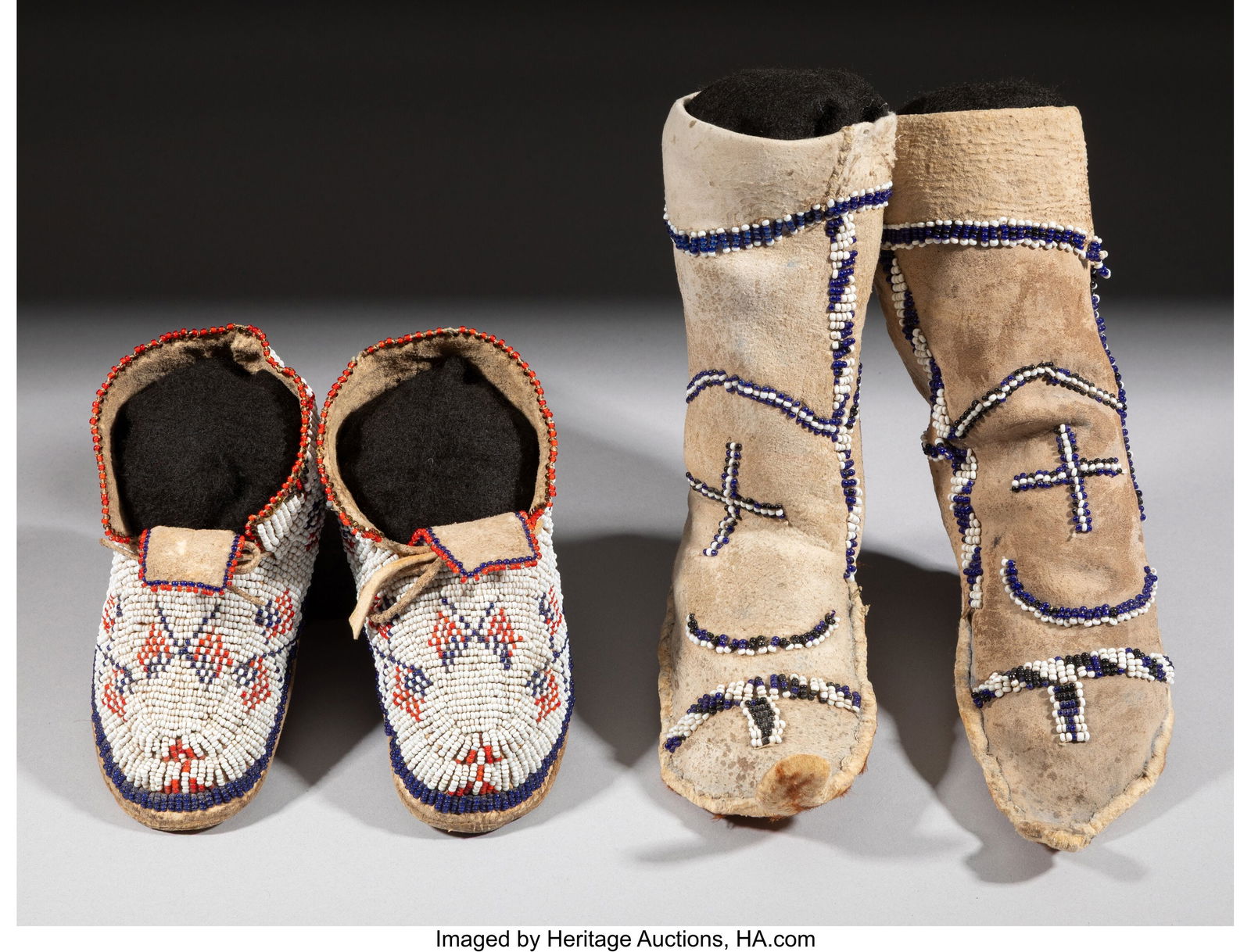 Two Pairs of Plains Child's Beaded Hide Moccasin: Two Pairs of Plains Child's Beaded Hide Moccasins c. 1885 and 1910 Including Sioux pictorial moccasins, each decorated with American flags stitched in red, white and blue beads&semi