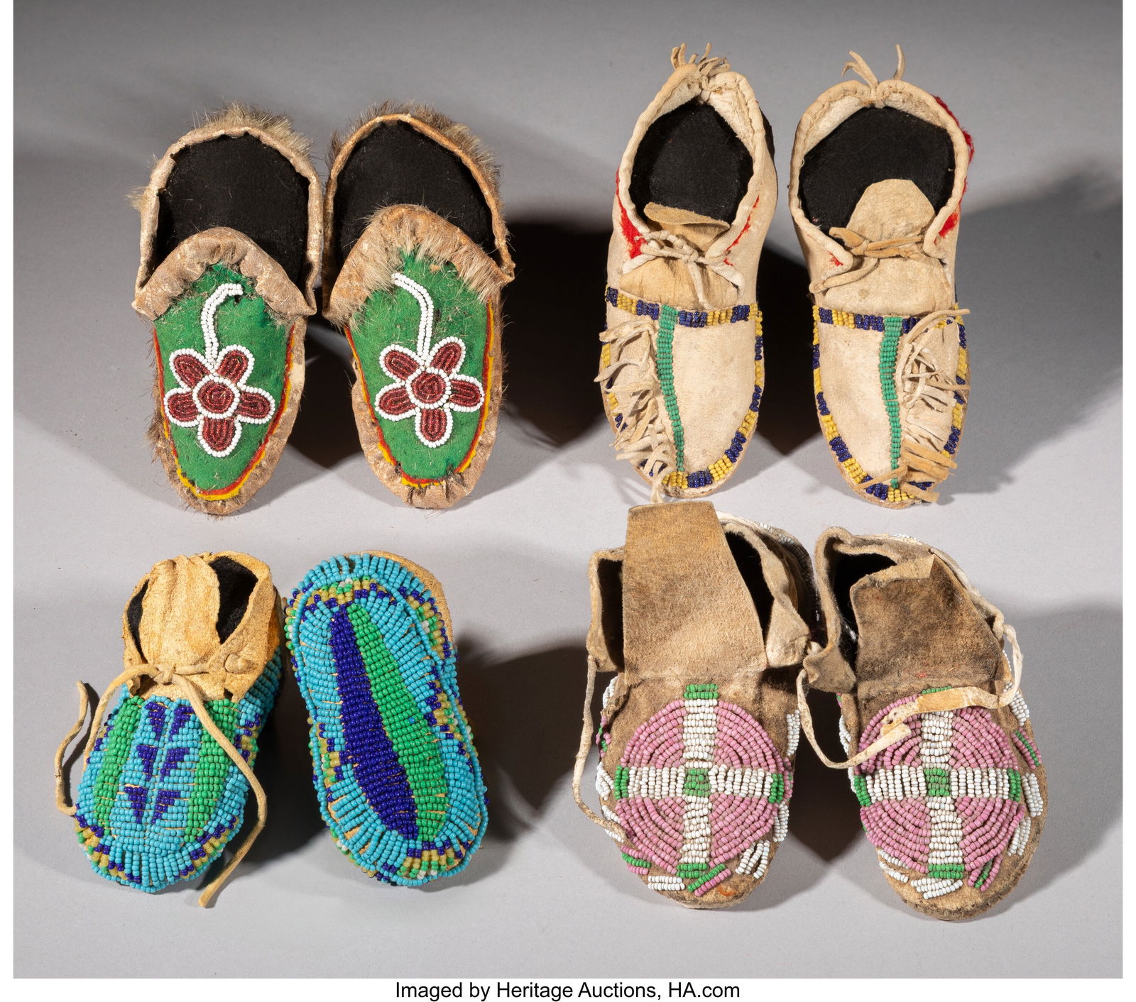 Four Pairs of Plains / Northwest Coast Child's B: Four Pairs of Plains / Northwest Coast Child's Beaded Hide Moccasins c. 1900 Including a Tlingit pair composed of seal skin with floral motifs, a Southern Plains example with fringed