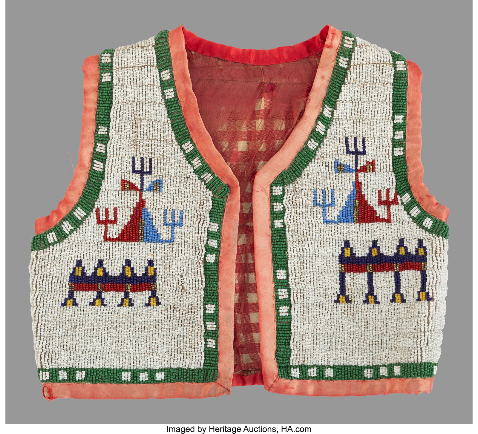 A Sioux Child's Beaded Hide Vest c. 1900 cons: A Sioux Child's Beaded Hide Vest c. 1900 constructed of hide, metal and glass seed beads, silk and cotton cloth, decorated on the front and back with geometric devices.