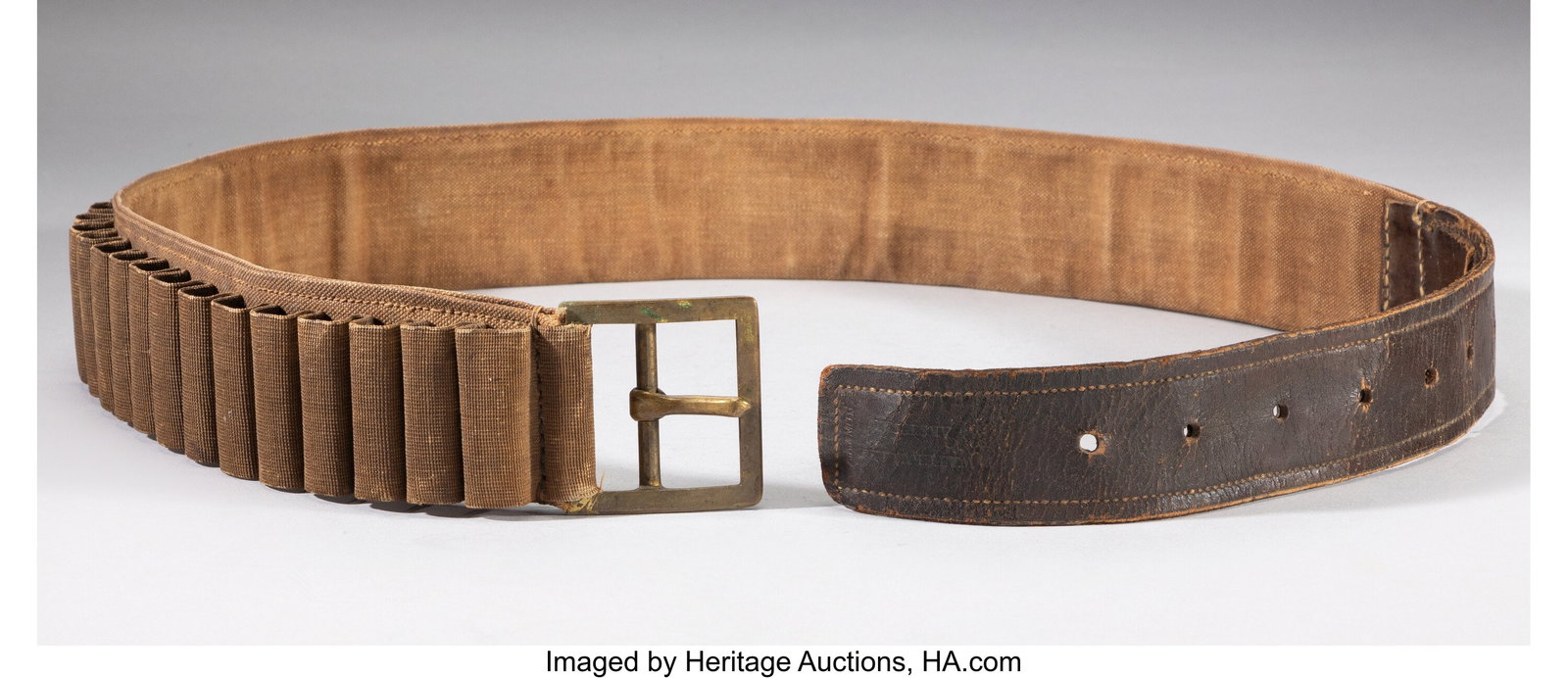 A First Model 1876 Pattern Cartridge Belt Wit: A First Model 1876 Pattern Cartridge Belt With 46 loops for .50-70 Springfield or Remington cartridges. Marked "Watervliet Arsenal" and "A. R. Smith." There is some 