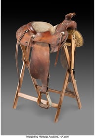70357&colon; A Tooled Leather Saddle   Sturdy riding saddle m