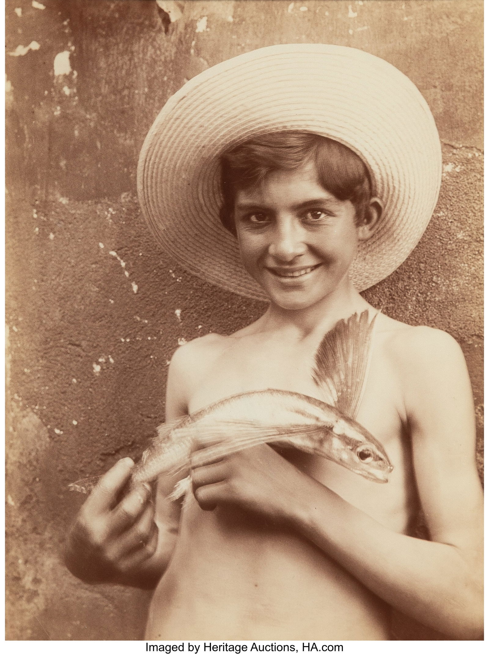 Wilhelm, Baron von Gloeden (German, 1856-1931) B: Wilhelm, Baron von Gloeden (German, 1856-1931) Boy with Flying Fish, circa 1890s Albumen print 8-3/4 x 6-1/2 inches (22.2 x 16.5 cm) (i