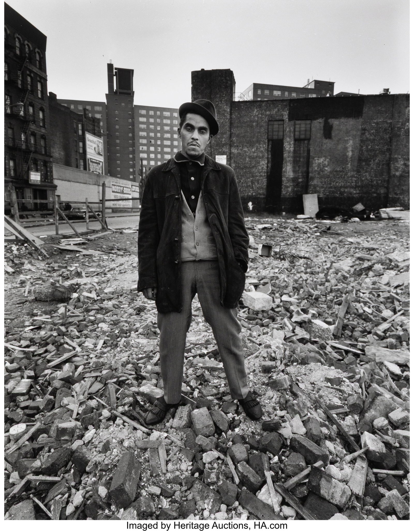 Bruce Davidson (American, b. 1933) Youth Standin: Bruce Davidson (American, b. 1933) Youth Standing on Rubble, East 100th Street, 1966 Gelatin silver print, printed later 11 x 8-3/4 inches (27.