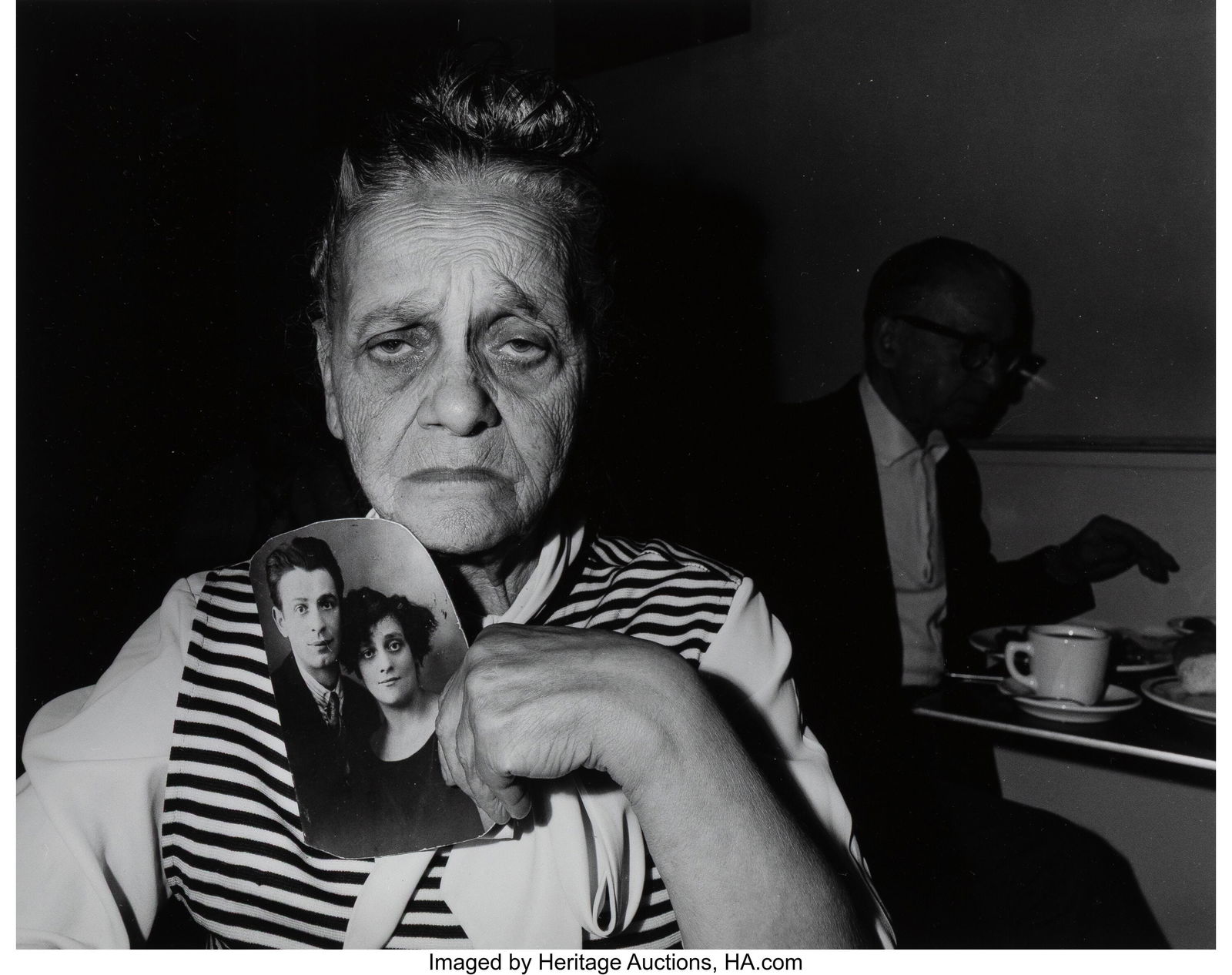 Bruce Davidson (American, b. 1933) Woman holding: Bruce Davidson (American, b. 1933) Woman holding Photograph, Garden Cafeteria, New York, 1973 Gelatin silver print 8-7/8 x 11-1/4 inches (22&perio
