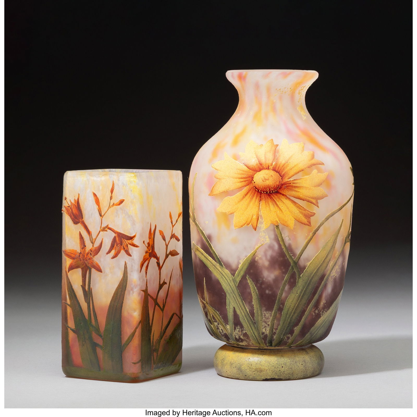 Daum Frères Sunflower and Tiger Lily Vases, cir: Daum Frères Sunflower and Tiger Lily Vases, circa 1900 Acid-etched and enameled glass 7 inches (17.8 cm) (tallest, Sunflower vase) Marks to tallest: Daum, Nancy, (Cross of Lorraine), France HID031010