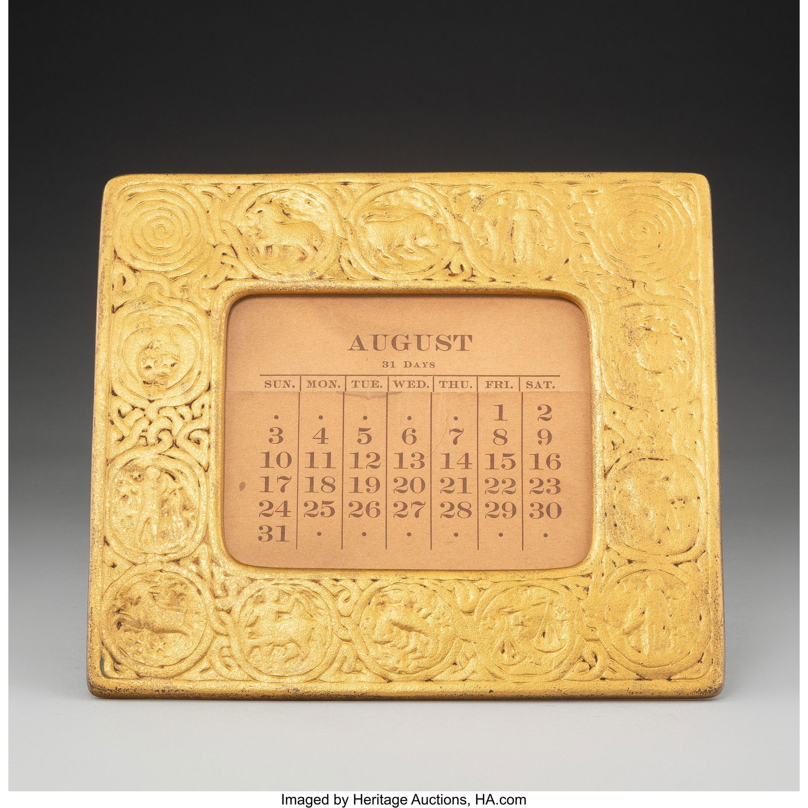 Tiffany Studios Zodiac Perpetual Desk Calendar,: Tiffany Studios Zodiac Perpetual Desk Calendar, circa 1900 Gilt bronze 7-1/4 x 8-1/4 x 3-1/2 inches (18.4 x 21.0 x 8.9 cm) Marks: TIFFANY STUDIOS