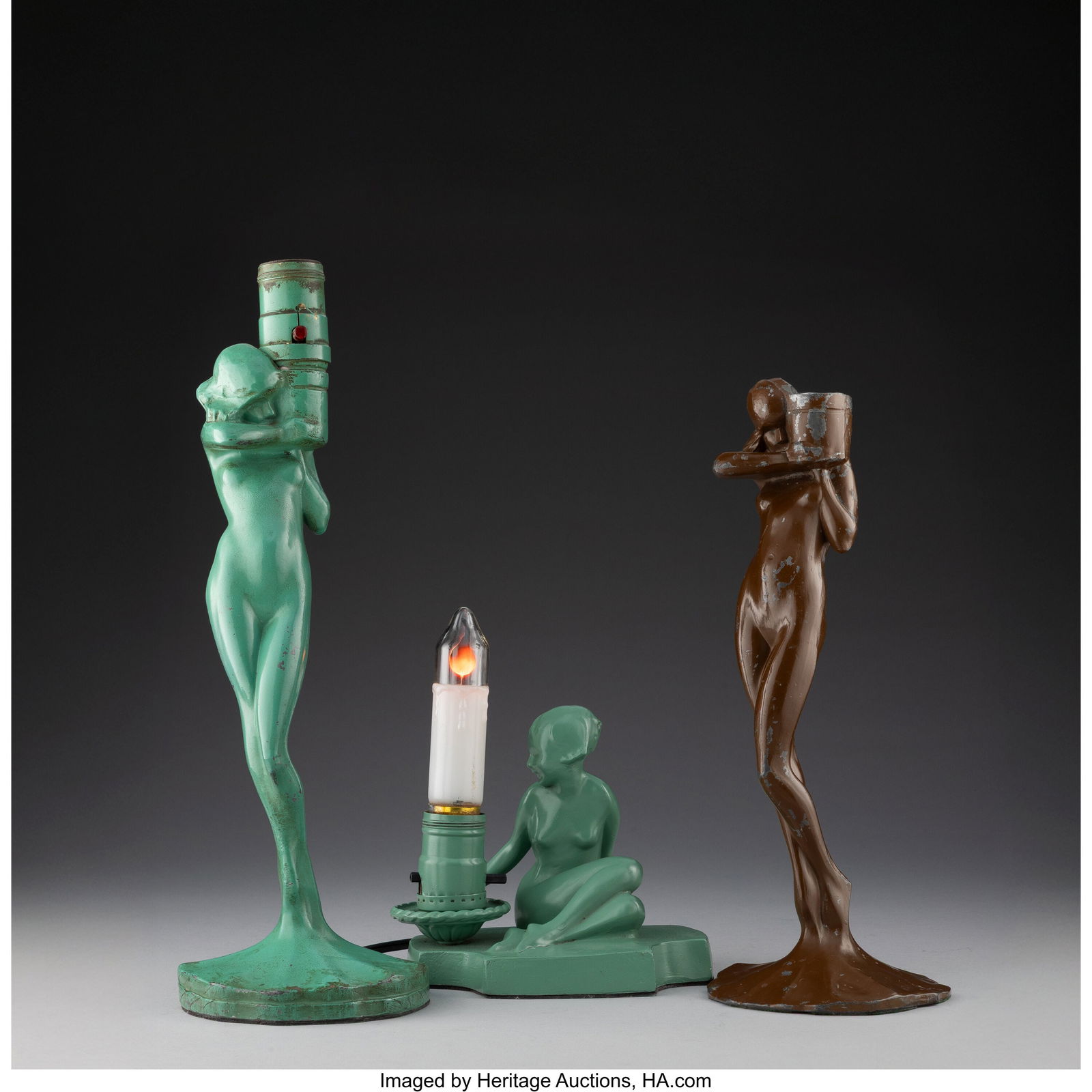 Frankart, Inc. Three Figural Light Fixtures, Mod: Frankart, Inc. Three Figural Light Fixtures, Models C101, L201 & L205, circa 1930 Enameled metal 14-1/4 x 4-1/4 x 4-1/4 inches (36.2 x 10.8 x 10.8 cm) (tallest, model L201) Marks to tallest: Co. 1922