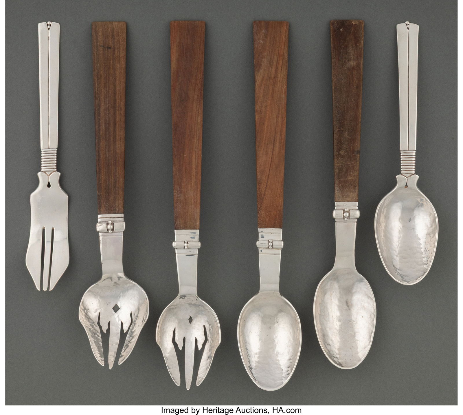 A Set of Six William Spratling Silver and Wood-H: A Set of Six William Spratling Silver and Wood-Handle Flatware Serving Pieces, Taxco, Mexico, mid-20th century Marks to longest: SPRATLING SILVER 12-1/2 inches (31&per