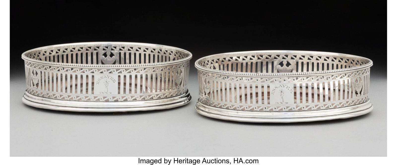 A Pair of Robert Hennell I Silver Wine Coasters,: A Pair of Robert Hennell I Silver Wine Coasters, London, 1741 Marks: (lion passant), (crowned leopard's head), RH, f 1-1/2 x 4-7/8 inche