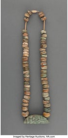 70250: A Bead Necklace with Avian Pendant  Reportedly f