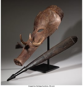 70318: A Dayak Boar Head Mask and a Massim Dance Paddle