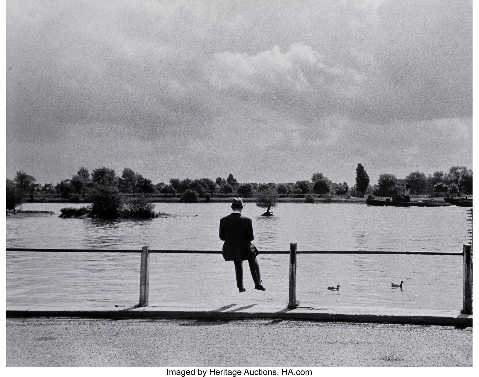 Cornell Capa (American, 1918-2008) Alec Guinness: Cornell Capa (American, 1918-2008) Alec Guinness Sitting Alone by a Lake in the Park, 1952 Gelatin silver print, printed later 10-1/2 x 13-1/4 inches (26&perio
