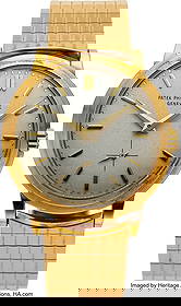 Patek Philippe, Ref: 2552J, 18k Gold "Disco-Vola: Patek Philippe, Ref: 2552J, 18k Gold "Disco-Volante" Calatrava, Unique Patek Philippe Bracelet, circa 1950's Case: 36 mm, 18k yellow gold case and band,