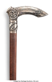 63104&colon; A Silver-Mounted and Carved Wood Cane&comma; circa 190