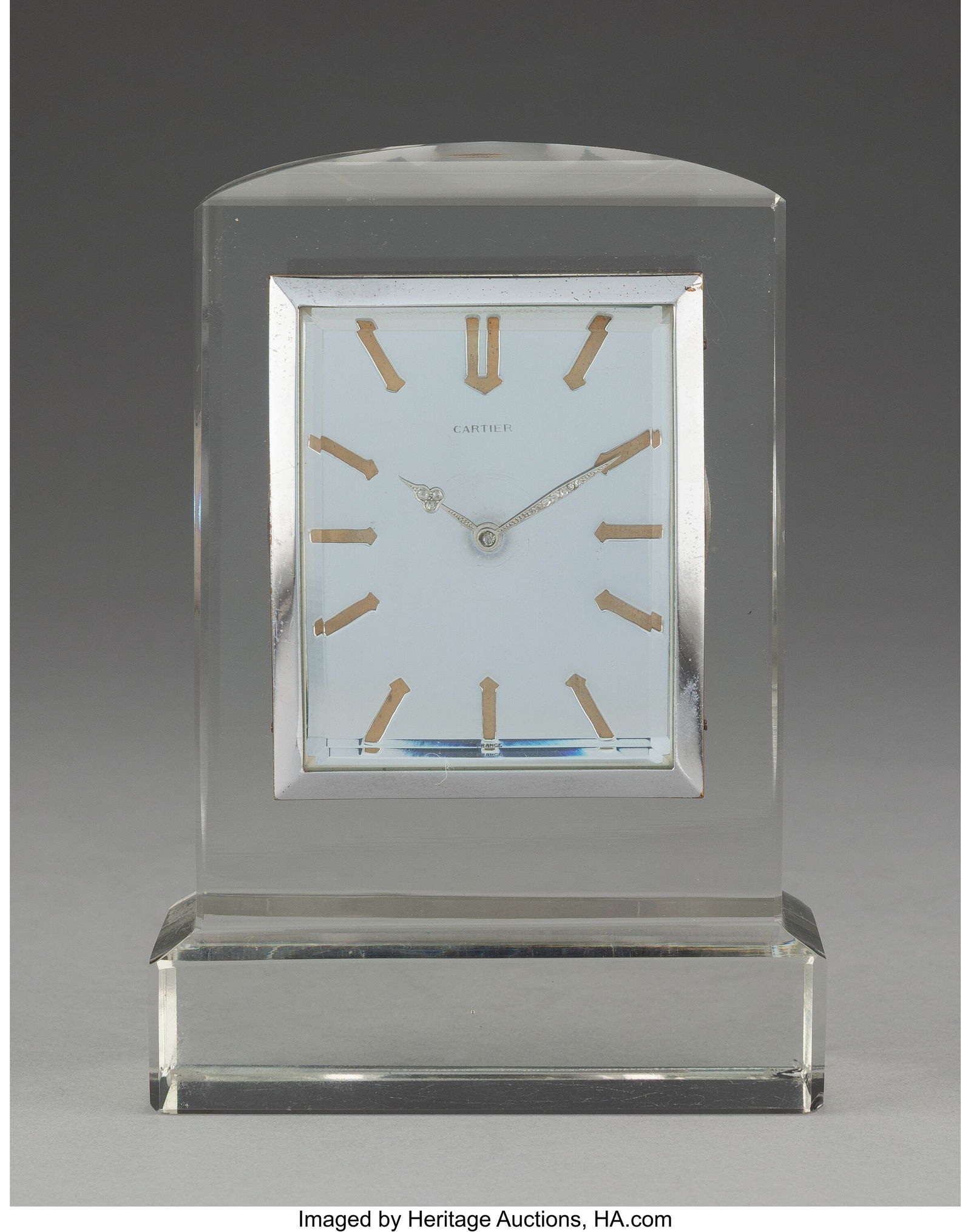A Cartier Rock Crystal and Rose-Cut Diamond Tabl: A Cartier Rock Crystal and Rose-Cut Diamond Table Clock, circa 1980 Mark to face: CARTIER 5-3/8 x 3-3/4 x 1-7/8 inches (13.7 x 9.5 x 4.8 cm) PROV