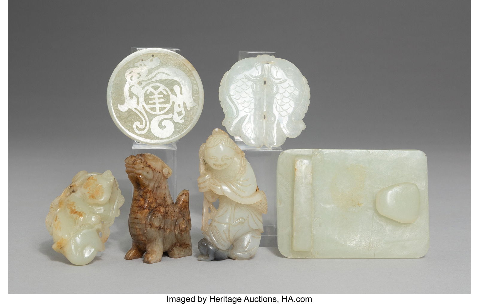 A Group of Six Chinese Jade and Mottled Celadon: A Group of Six Chinese Jade and Mottled Celadon Jade Carvings 2-7/8 x 2-1/8 x 0-3/8 inches (7.3 x 5.4 x 1.0 cm) (largest, belt buckle) HID031