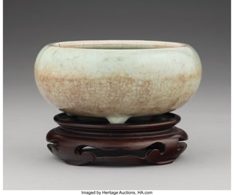 28125: A Chinese Crackled Celadon Glazed Tripod Censer,