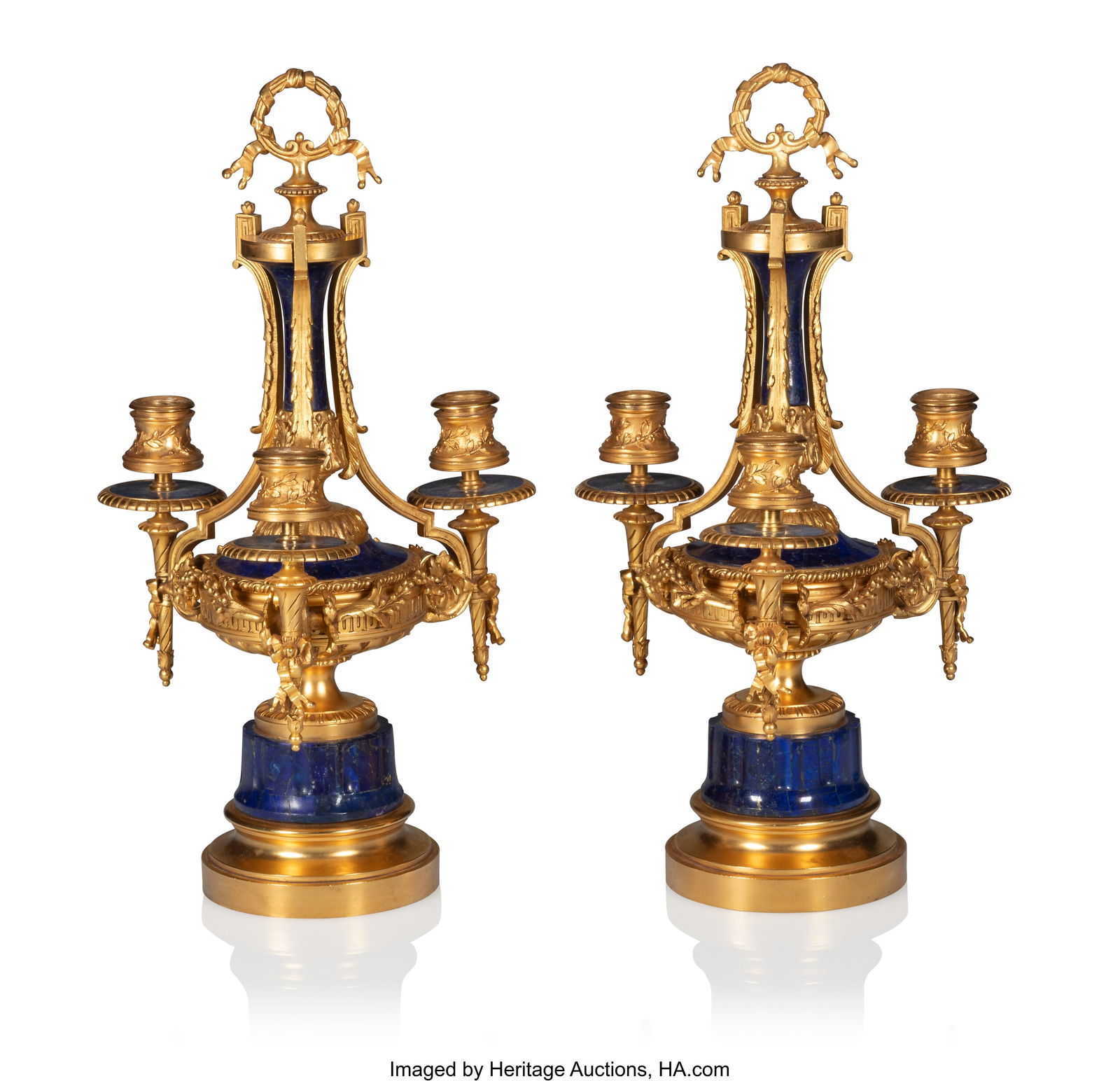 A Pair of Russian Ormolu-Mounted Lapis Lazuli Ve: A Pair of Russian Ormolu-Mounted Lapis Lazuli Veneered Candlesticks Unknown Maker, likely St. Petersburg, third quarter 19th century 16-1/4 x 8-1/2 x 8-1/2 inches (
