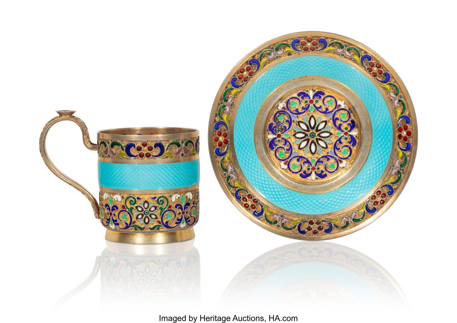 A Russian Gilt Silver Cloisonné, Plique à Jour: A Russian Gilt Silver Cloisonné, Plique à Jour , and Guilloché Enameled Demitasse Cup and Saucer 11th Artel, Moscow, 1908-1917, and with scratched in