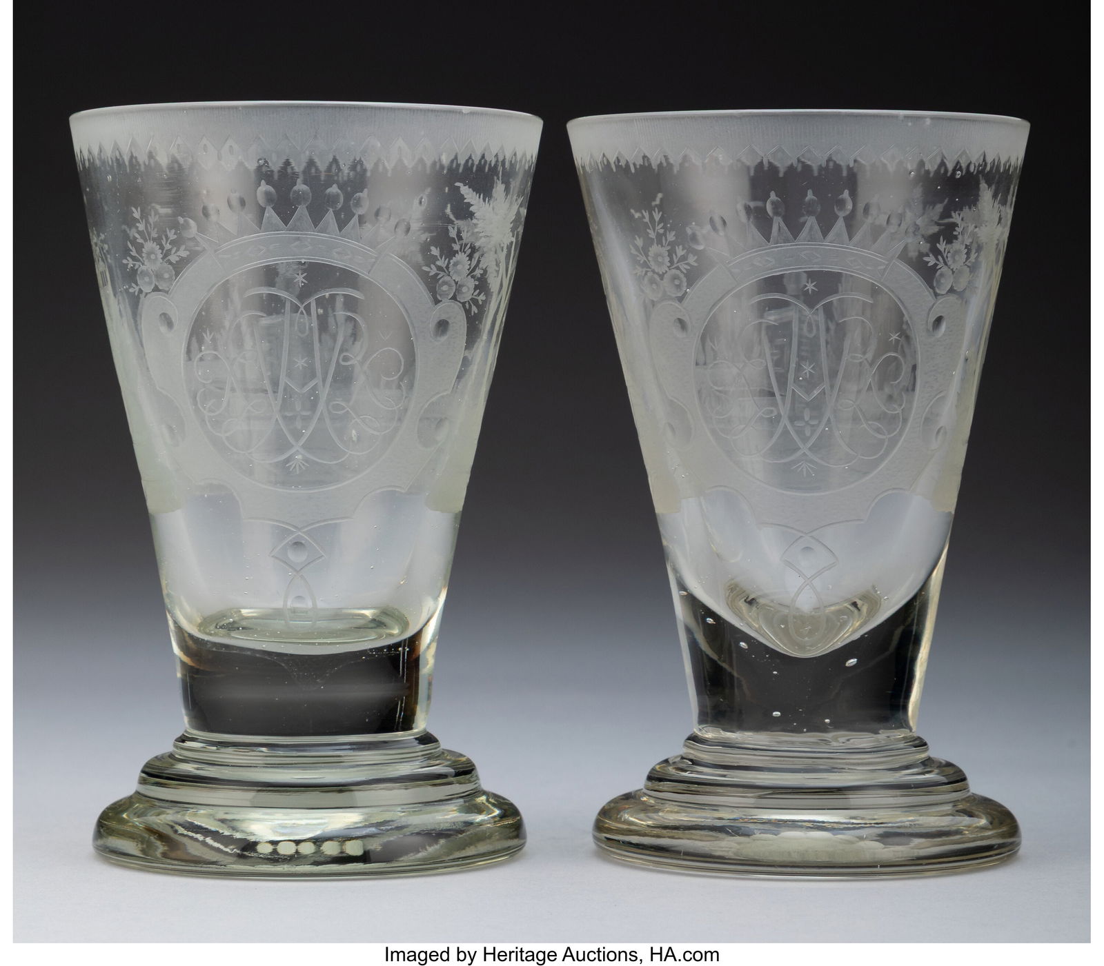 A Pair of Lauenstein Engraved Glass Beakers, mid: A Pair of Lauenstein Engraved Glass Beakers, mid-18th century 6-1/4 x 4 inches (15.9 x 10.2 cm) (each, diam.) Monogram: RAR Property from