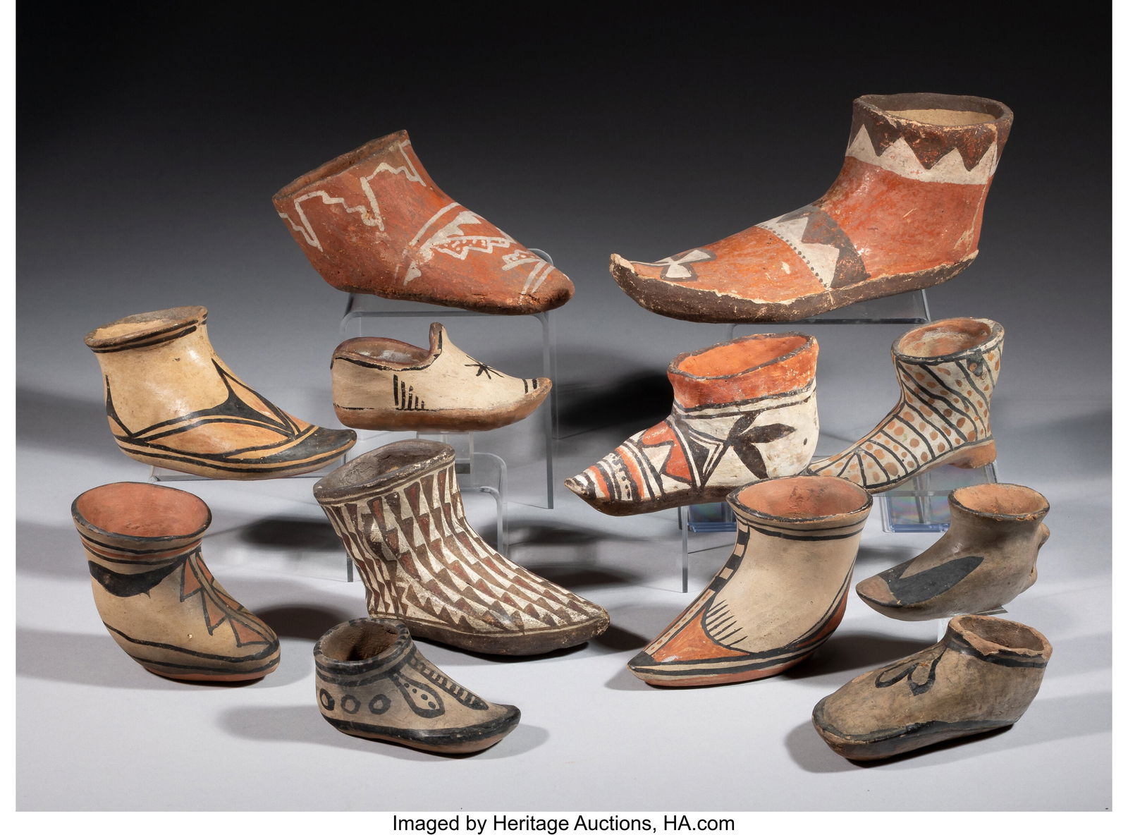 Twelve Pueblo Pottery Moccasins 3-1/4 x 3 x 8-1/: Twelve Pueblo Pottery Moccasins 3-1/4 x 3 x 8-1/2 inches (8.3 x 7.6 x 21.6 cm) HID03101062020 © 2025 Heritage Auctions | All Rights Reserved www&period
