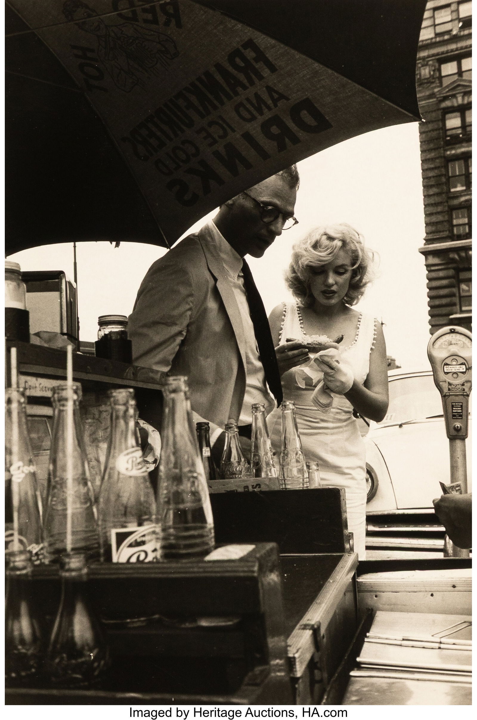 Sam Shaw (American, 1912-1999) Marilyn Monroe an: Sam Shaw (American, 1912-1999) Marilyn Monroe and Arthur Miller in New York City (Marilyn Eating a Hot Dog), 1957 Gelatin silver print, printed later 9-3/8 x