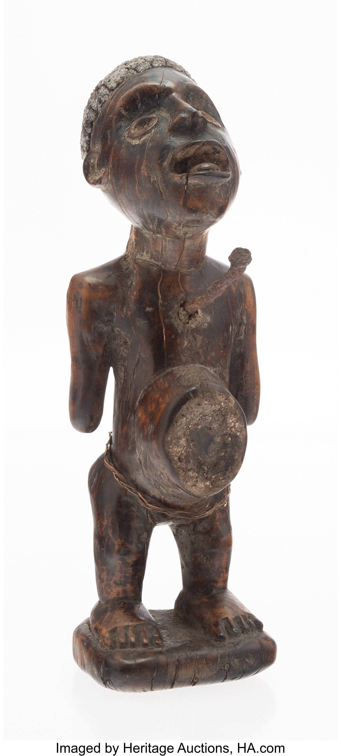 (Kongo) Democratic Republic of Congo N'kisi (Pow: (Kongo) Democratic Republic of Congo N'kisi (Power Figure) Wood, hardware 12-1/4 x 3-3/4 x 6-3/4 inches (31.1 x 9.5 x 17.1 cm) Prop