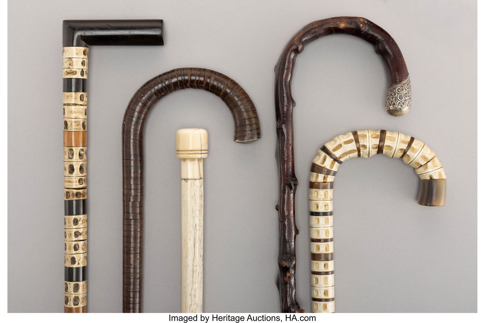 A Collection of Five Textured Bone and Wood Cane: A Collection of Five Textured Bone and Wood Canes Marks to tallest: (lion passant), (leopard's head), K, (effaced maker's mark) 35-3/4 x 5 inc