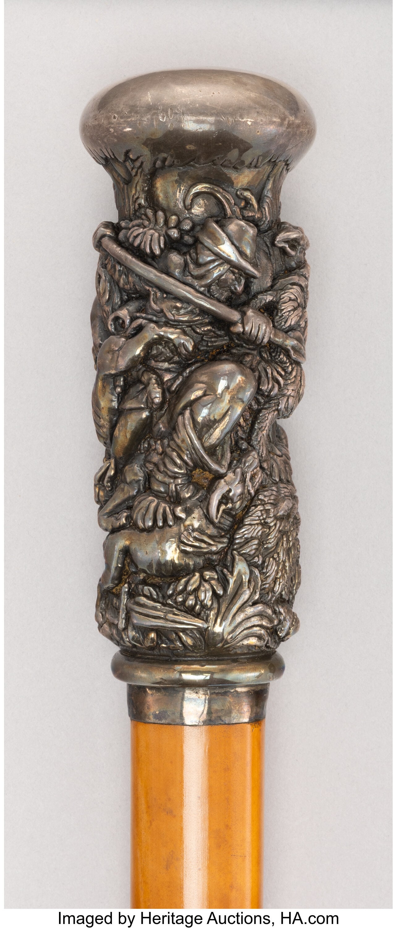 A Silver-Mounted and Carved Wood Cane Marks: SIL (1 of 6)