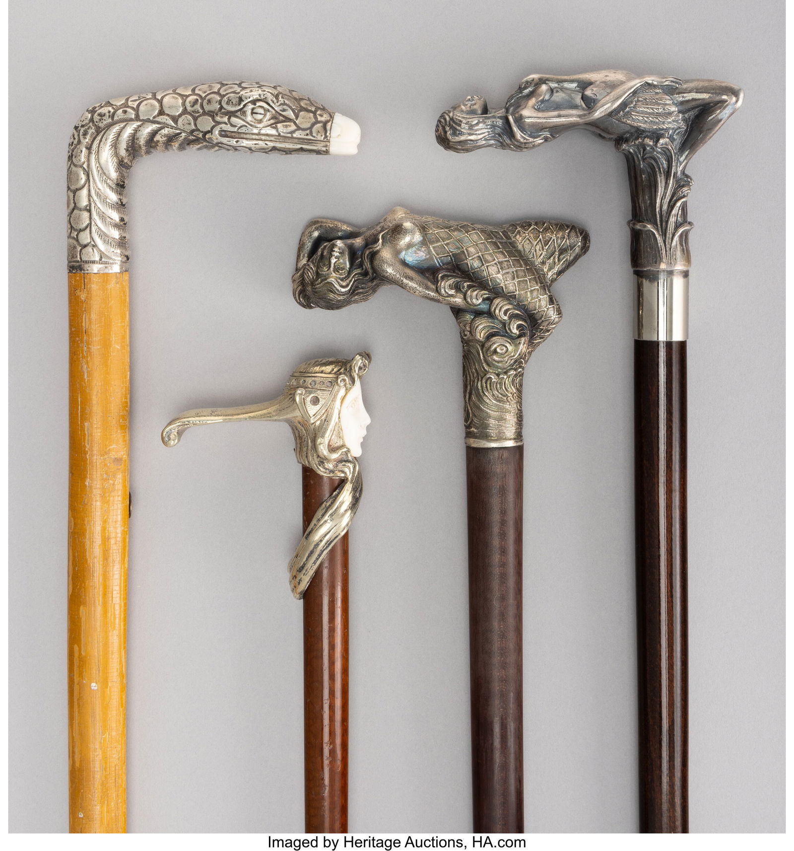 Four Silver and Metal-Mounted and Carved Wood Fi: Four Silver and Metal-Mounted and Carved Wood Figural Canes, circa 1900 Marks to one: STERLING 36-1/2 x 4-3/8 x 1-1/4 inches (92.7 x 11.1 x 3.2 cm&rpa