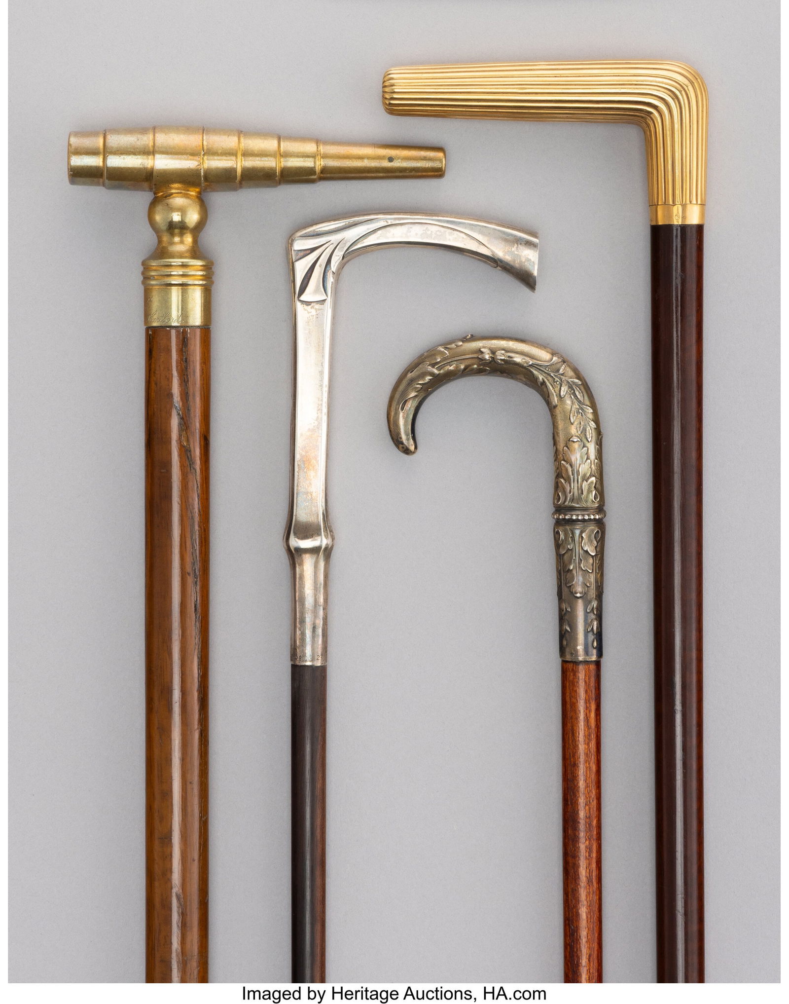 Four Brass, Silver, Metal-Mounted and Carved Woo: Four Brass, Silver, Metal-Mounted and Carved Wood Canes, circa 1889 and later 35-1/2 x 3-3/4 x 0-3/4 inches (90.2 x 9.5 x 1.9 cm) The lot c