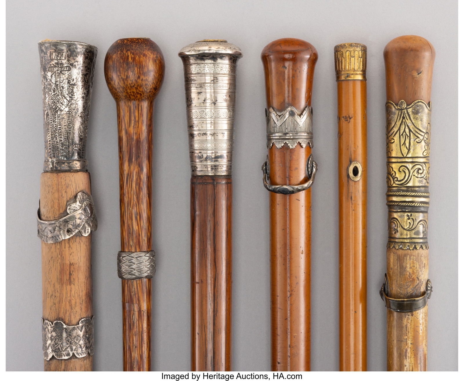 Six Metal-Mounted and Carved Wood Canes, circa 1: Six Metal-Mounted and Carved Wood Canes, circa 1900 49-3/4 x 0-7/8 x 0-7/8 inches (126.4 x 2.2 x 2.2 cm) (tallest) HID03101062020 © 2026