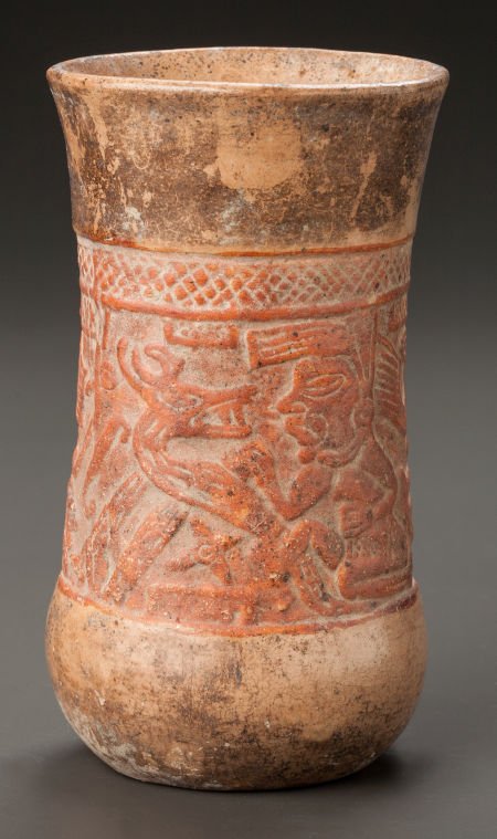A MAYA CUP WITH MOLDED MYTHOLOGICAL SCENE c. 600: A MAYA CUP WITH MOLDED MYTHOLOGICAL SCENE c. 600 - 900 AD The gracefully formed cup is slipped in blac