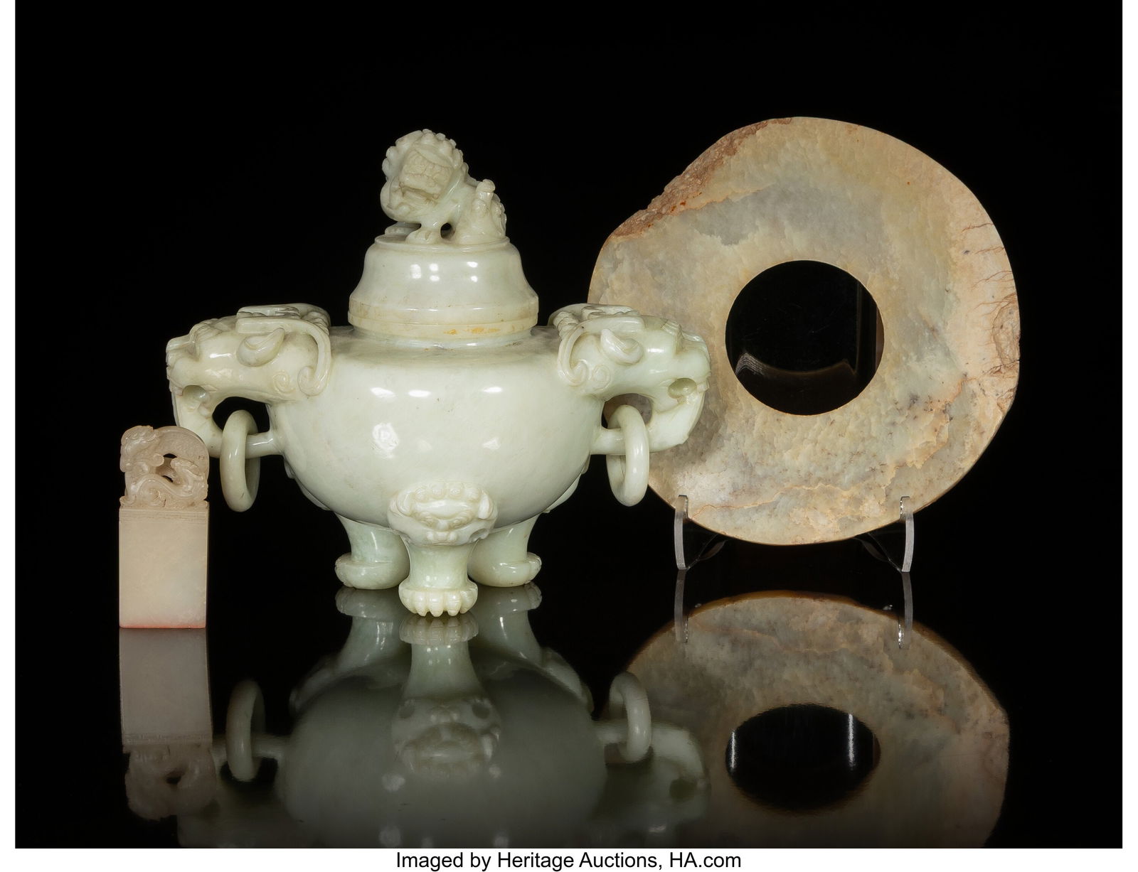 Three Chinese Carved Jade Table Articles 6-1/2 x: Three Chinese Carved Jade Table Articles 6-1/2 x 7 x 4-3/8 inches (16.5 x 17.8 x 11.1 cm) (tallest, covered tripod censer) The lot comprising&col